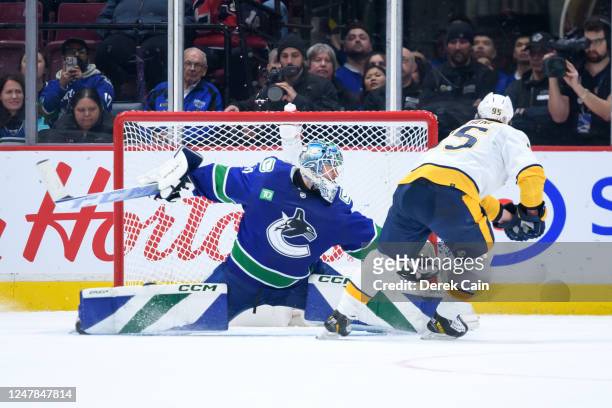 Goaltender Arturs Silovs of the Vancouver Canucks makes a save on Matt Duchene of the Nashville Predators in the shootout at Rogers Arena on March 6,...