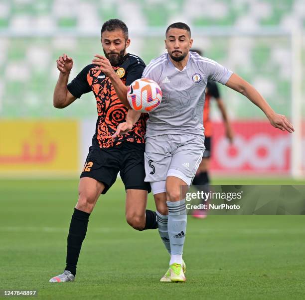 Khaled Abdelraout Alrigi of Umm Salal SC and Hamroun Jugurtha of Al-Khor SC battle for the ball during the Amir Cup Qatar 22/23 match between Umm...