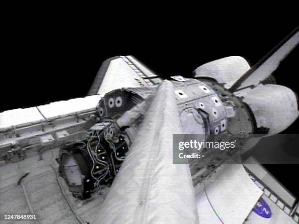Unity Module In Shuttle US space shuttle Endeavour's robot arm lifts the Unity module 05 ...