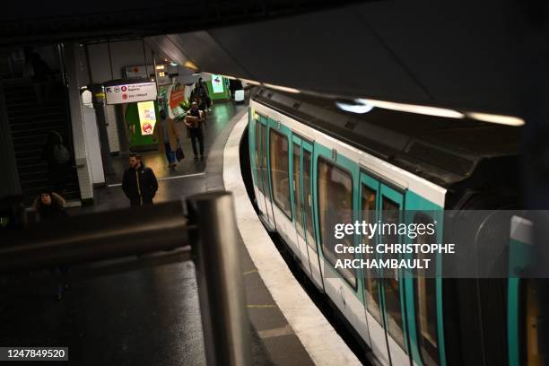 Commuter sits in a carriage at the Gare de l'Est metro station in Paris, on March 7 as fresh strikes and protests are planned against the...