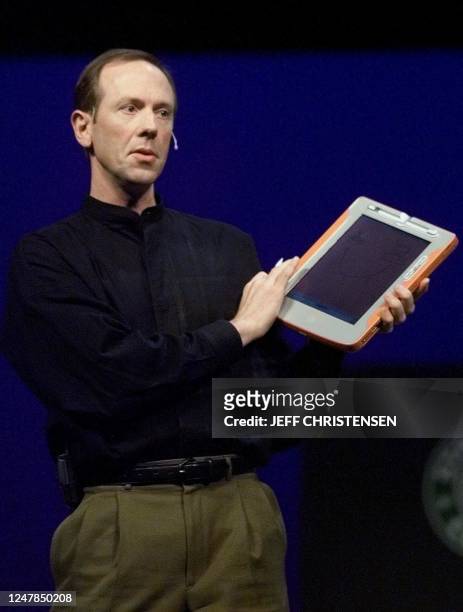 Bert Keely, a software architect at Microsoft Corp., shows a prototype of the "Tablet PC" product that is being developed by Microsoft's emerging...