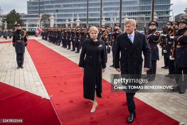 The President of Slovakia Zuzana Caputova and King Willem-Alexander of the Netherlands review the Slovak guard of honour during a welcome ceremony at...