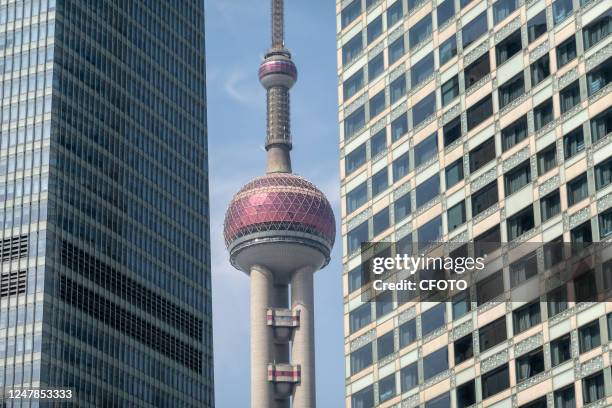 The Oriental Pearl Tower, Shanghai Tower, Jinmao Tower and World Financial Center are seen on Lujiazui Street, Shanghai, China, March 7, 2023.