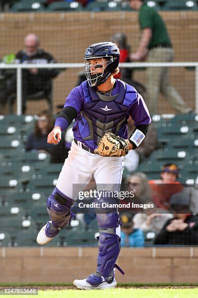 Drew Romo C Drew Romo of the Colorado Rockies warms up during the ninth inning of ...