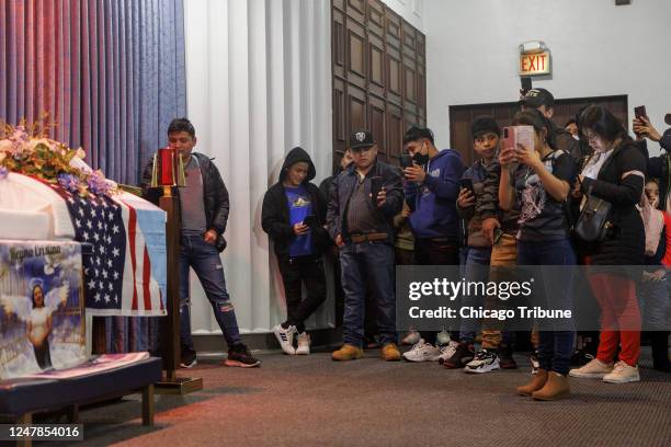 An American flag is draped over the coffin of Reyna Cristina Ical Seb who was found fatally shot last week in the Little Village neighborhood Monday,...