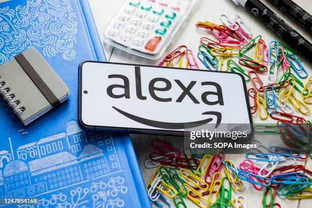 In this photo illustration an Amazon Alexa logo seen displayed on a smartphone.