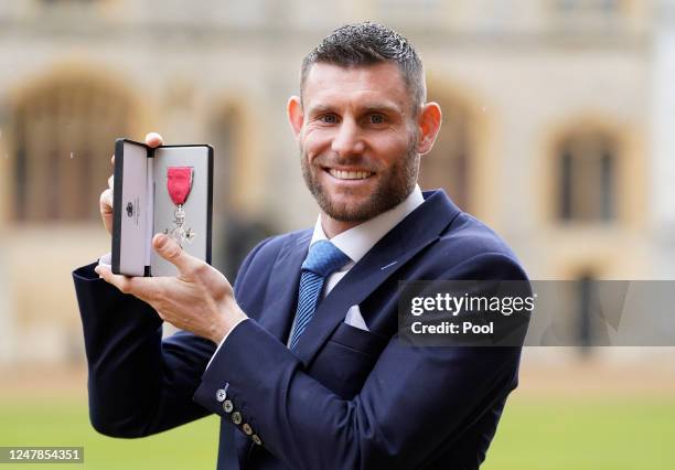 James Milner after being made a Member of the Order of the British Empire by the Prince of Wales during an investiture ceremony at Windsor Castle on...