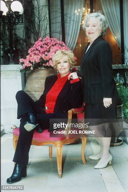 American actress Kim Novak and the daughter of director Alfred Hitchcock, Patricia pose 24 February 1997 in Paris for the promotion of Hitchkock's...
