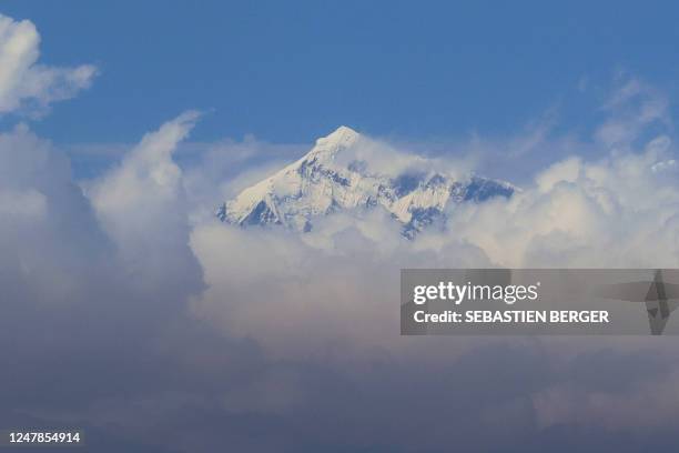 An aerial picture taken midair from an helicopter shows the summit of Mount Everest, the highest mountain in the world at 8,848 metres, in Nepal's...