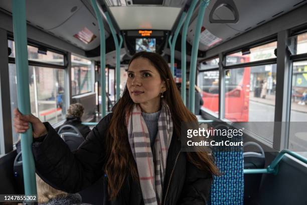 Ukrainian refugee Yevhenia Shymshyrian takes a bus to her English lesson after working at a school in Richmond on March 6, 2023 in London, England....