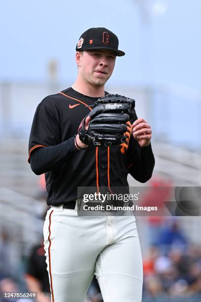 Kyle Harrison of the San Francisco Giants throws a pitch during the sixth inning of a spring training game against the Arizona Diamondbacks at...