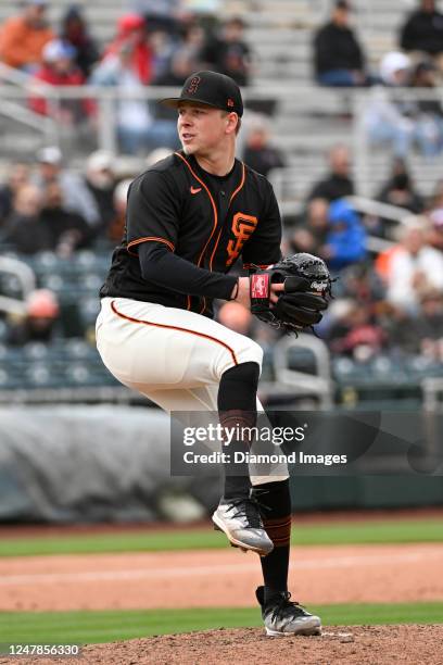 Kyle Harrison of the San Francisco Giants throws a pitch during the sixth inning of a spring training game against the Arizona Diamondbacks at...