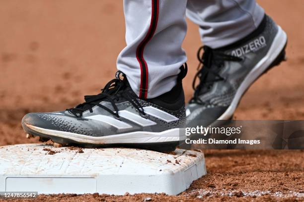 Closeup view of Adidas cleats worn by Jordan Lawlar of the Arizona Diamondbacks during the eighth inning of a spring training game against the San...