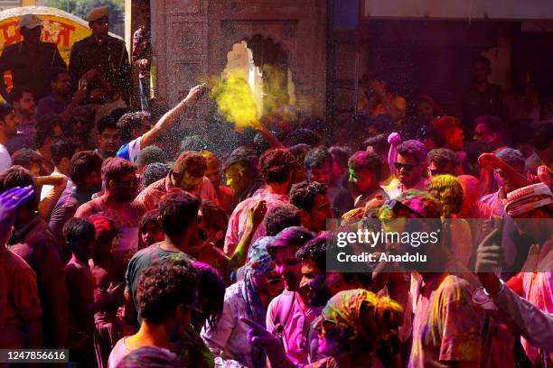 People Smear with colours as they celebrate holi Festival Celebration in Pushkar, India on 07 March 2023.