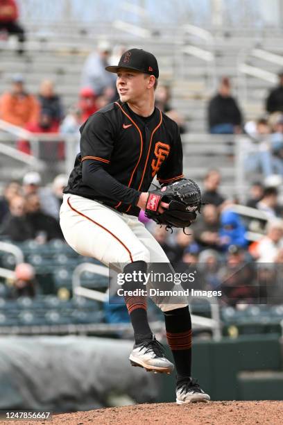 Kyle Harrison of the San Francisco Giants throws a pitch during the sixth inning of a spring training game against the Arizona Diamondbacks at...