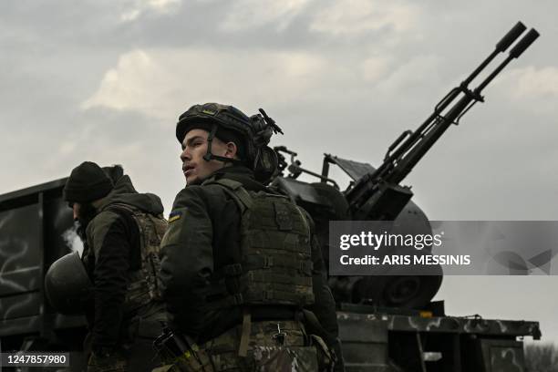 Ukrainian serviceman stands in front of an anti-aircraft machine gun, in Siversk, Donbas region, on March 7 amid the Russian invasion of Ukraine.