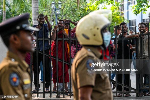 Anti-government demonstrators and university students shout slogans during a protest demanding the release of Inter University Students' Federation...