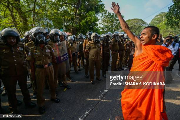 Buddhist monk shouts slogans during a protest demanding the release of Inter University Students' Federation leaders and urging the government to...