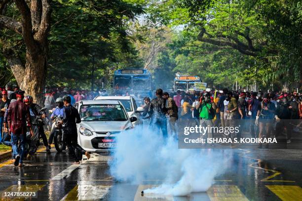 Police use tear gas to disperse anti-government demonstrators and university students during a protest demanding the release of Inter University...