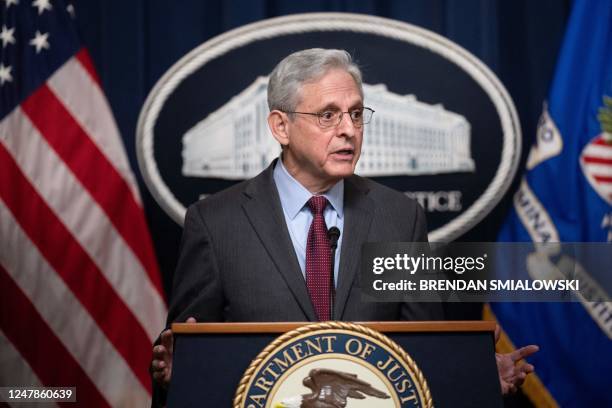 Attorney General Merrick Garland speaks during a press conference at the US Department of Justice to announce efforts to stop a merger between...