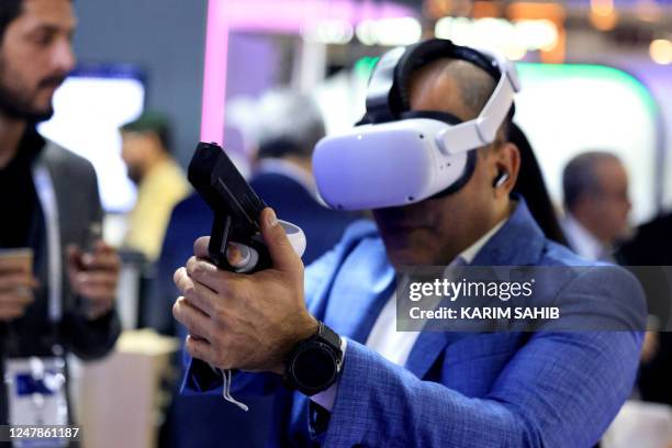 Man tries on a virtual reality set during the World police Summit 2023 in Dubai on March 7, 2023.