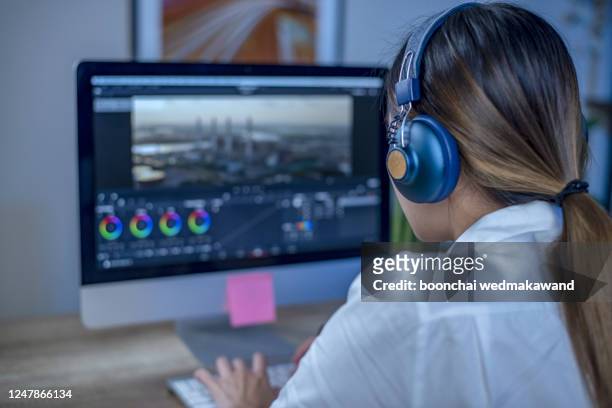 working woman video editing in the studio - video editing foto e immagini stock