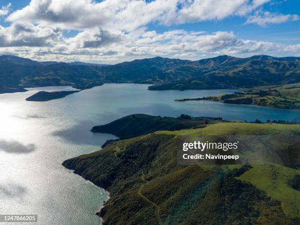 water and mountain, aerial view of akaroa beautiful scenery, new zealand - akaroa stock-fotos und bilder