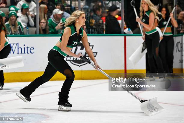 The Dallas Stars Ice Girls clear the ice during the game between the Dallas Stars and the Calgary Flames on March 6, 2023 at American Airlines Center...