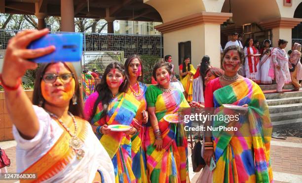 People spread abir celebrating Dol Purnima festival at Dhakeshwari national temple in Dhaka, Bangladesh, on 07 March 2023.