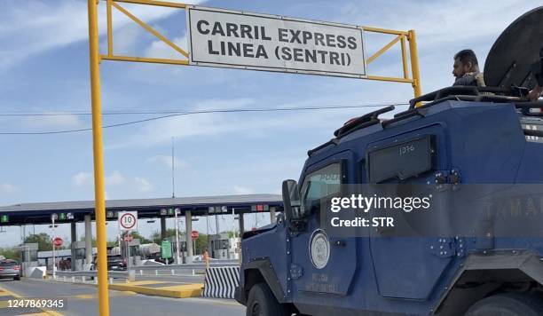 National Guard and military vehicles take part in an operation to transfer two of the four US citizens kidnapped in Mexico's crime-ridden northeast,...