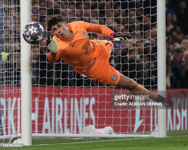Chelsea's Spanish goalkeeper Kepa Arrizabalaga dices to save a free-kick during the UEFA Champions League round of 16 second-leg football match...