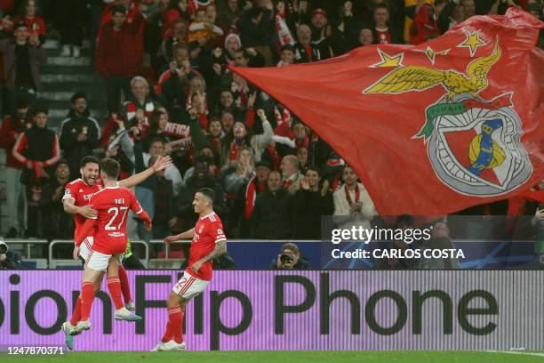 Benfica's Portuguese midfielder Rafa Silva celebrates scoring the opening goal during the UEFA Champions League round of 16 second leg football match...