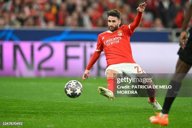 Benfica's Portuguese midfielder Rafa Silva scores the opening goal during the UEFA Champions League round of 16 second leg football match between SL...