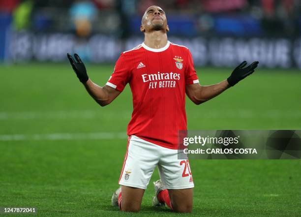 Benfica's Portuguese midfielder Joao Mario celebrates scoring his team's fourth goal during the UEFA Champions League round of 16 second leg football...