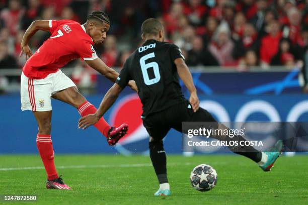 Benfica's Brazilian midfielder David Neres scores his team's fifth goal during the UEFA Champions League round of 16 second leg football match...