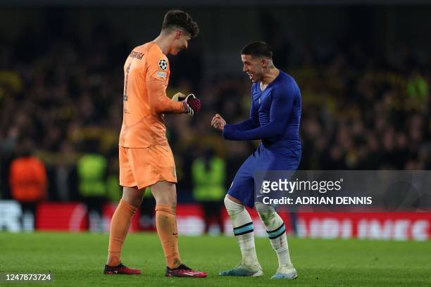 Chelsea's Spanish goalkeeper Kepa Arrizabalaga and Chelsea's Argentinian midfielder Enzo Fernandez celebrate after the UEFA Champions League round of...