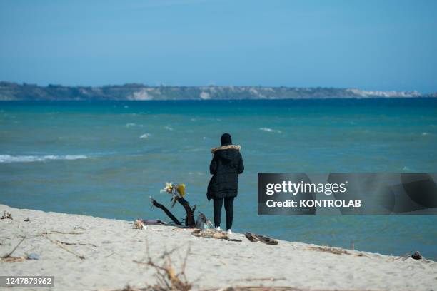 Relative of a migrant who went missing after the tragedy of the migrant boat that sank on February 26, walks on the beach. In the shipwreck off the...