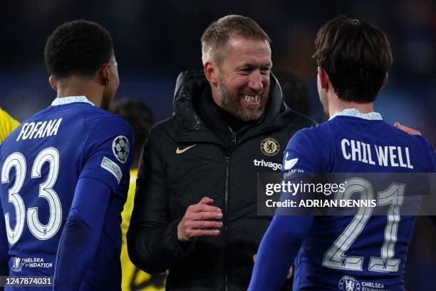 Chelsea's English head coach Graham Potter celebrate with Chelsea's English defender Ben Chilwell a after the UEFA Champions League round of 16...