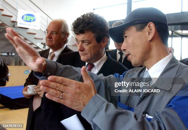 French minister of Labor, Social Cohesion and Housing Jean-Louis Borloo and president of the regional council of Loiret, senator Eric Dolige listen...