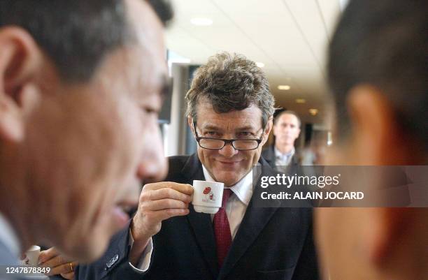 French minister of Labor, Social Cohesion and Housing Jean-Louis Borloo talks with the president of Ibiden DPF France, Japanese Hidetoshi Yamauchi ,...