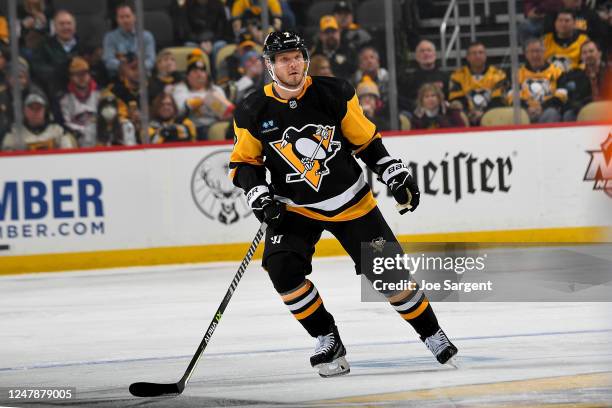 Dmitry Kulikov of the Pittsburgh Penguins skates against the Columbus Blue Jackets at PPG PAINTS Arena on March 7, 2023 in Pittsburgh, Pennsylvania.