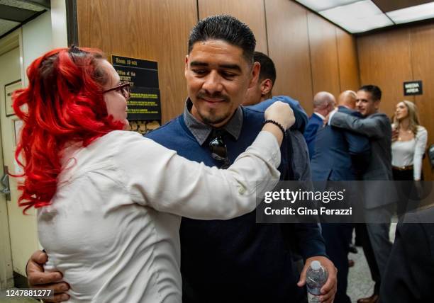 Aunt Crystal Diuguid hugs Anthony Avalos father Victor Avalos after Heather Barron and Kareem Leiva were convicted of murdering 10-year-old Avalos at...