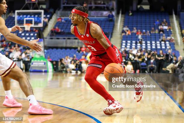 El Ellis of the Louisville Cardinals drives to the basket during the ACC Tournament against the Boston College Eagles on March 7, 2023 at Greensboro...