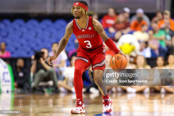 El Ellis of the Louisville Cardinals brings the ball down the court during the ACC Tournament against the Boston College Eagles on March 7, 2023 at...