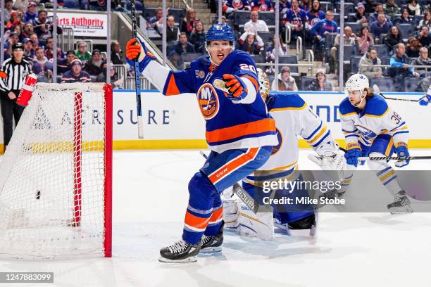 Hudson Fasching of the New York Islanders celebrates after scoring a goal past Ukko-Pekka Luukkonen of the Buffalo Sabres during the third period at...