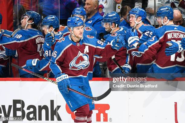 Mikko Rantanen of the Colorado Avalanche celebrates with players on the bench after scoring a first period goal against the San Jose Sharks at Ball...