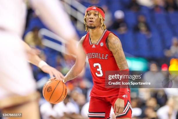 El Ellis of the Louisville Cardinals brings the ball down the court during the ACC Tournament against the Boston College Eagles on March 7, 2023 at...