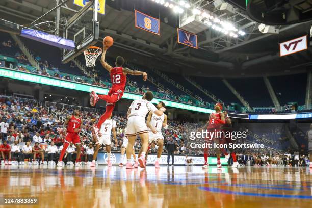 Traynor of the Louisville Cardinals lays the ball up during the ACC Tournament against the Boston College Eagles on March 7, 2023 at Greensboro...