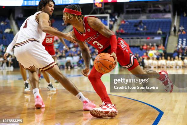 El Ellis of the Louisville Cardinals drives to the basket during the ACC Tournament against the Boston College Eagles on March 7, 2023 at Greensboro...