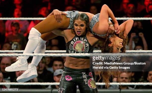 Bianca Belair carries Carmella during WWE Monday Night Raw at the TD Garden on March 6, 2023 in Boston, Massachusetts